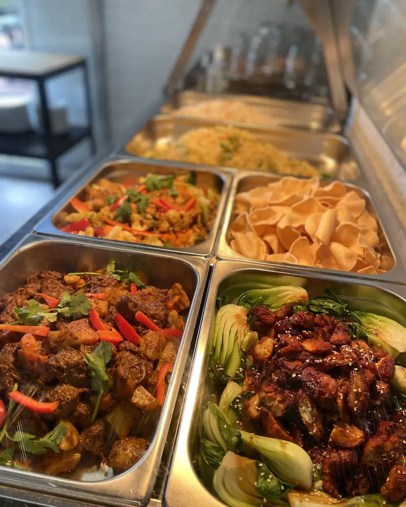 Curries, crackers and stir fried greens on the Sunday buffet