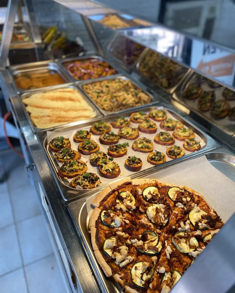 Sunday buffet trays with stuffed sweet potato, pizza and curries at Loving Hut Perth